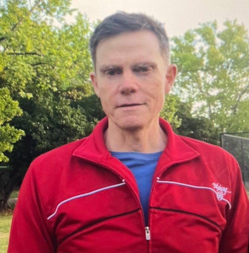 Man in red jacket.