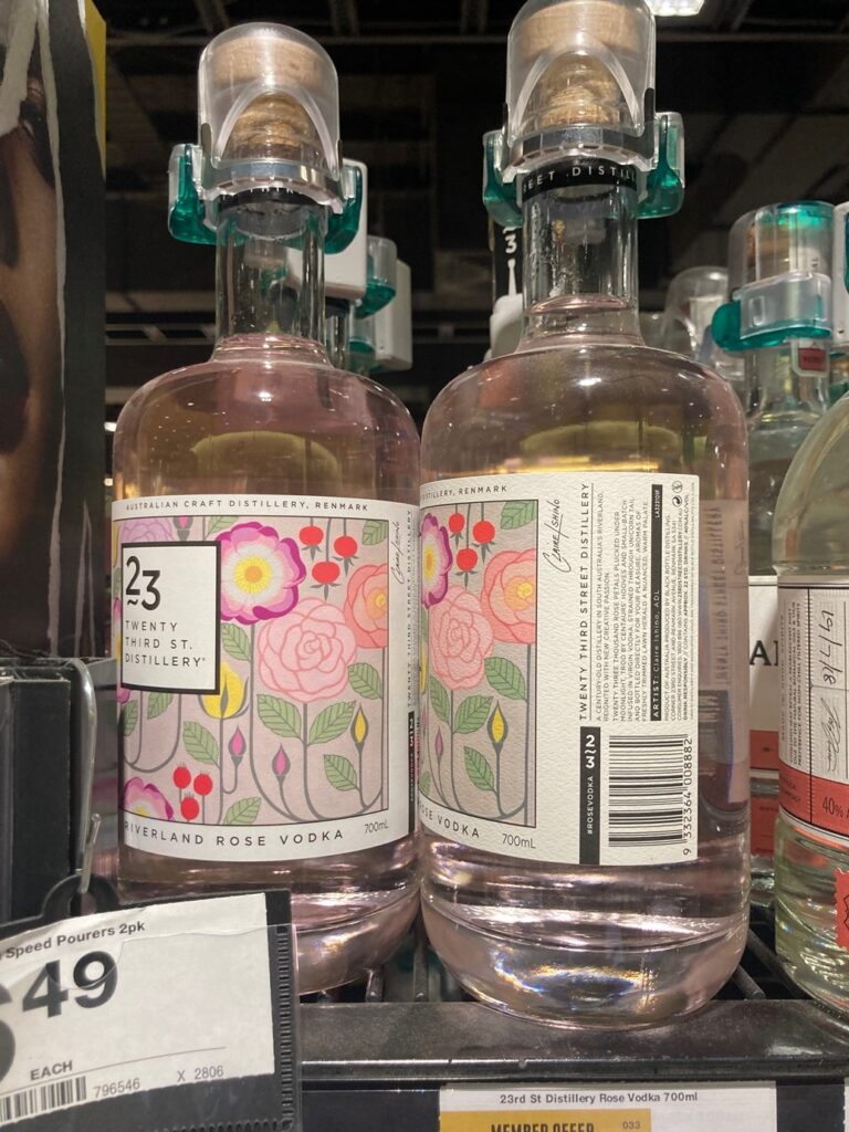Three pink alcohol bottles as described in the body text