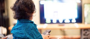 A young child watching television