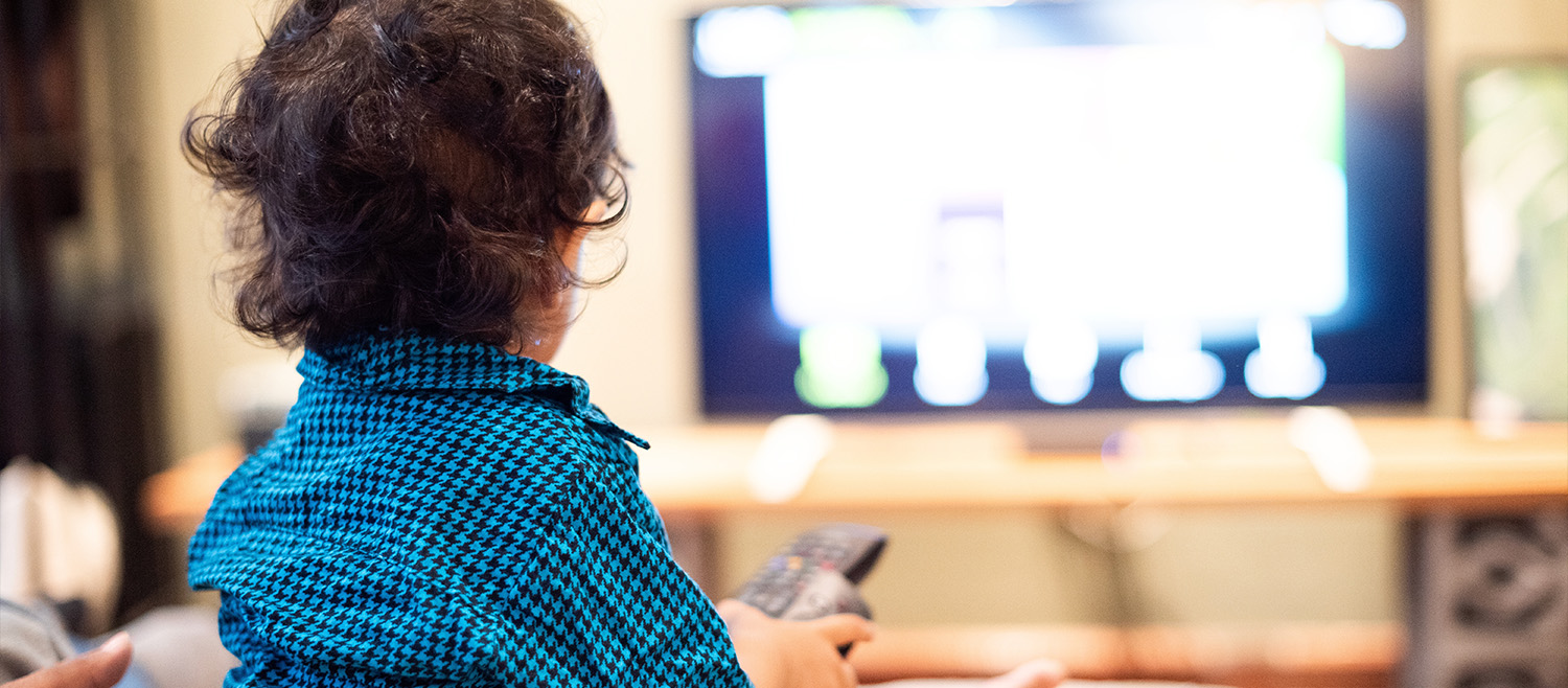 A young child watching television