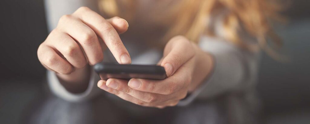 Close up of woman's hands holding a smartphone