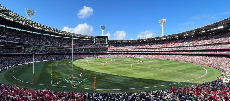 A large sporting stadium filled with people.
